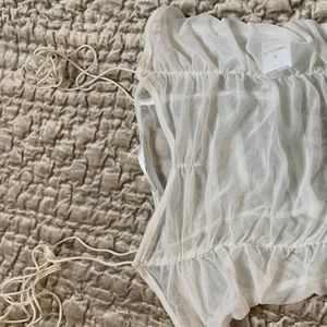 white transparent tie shoulder cinched crop top